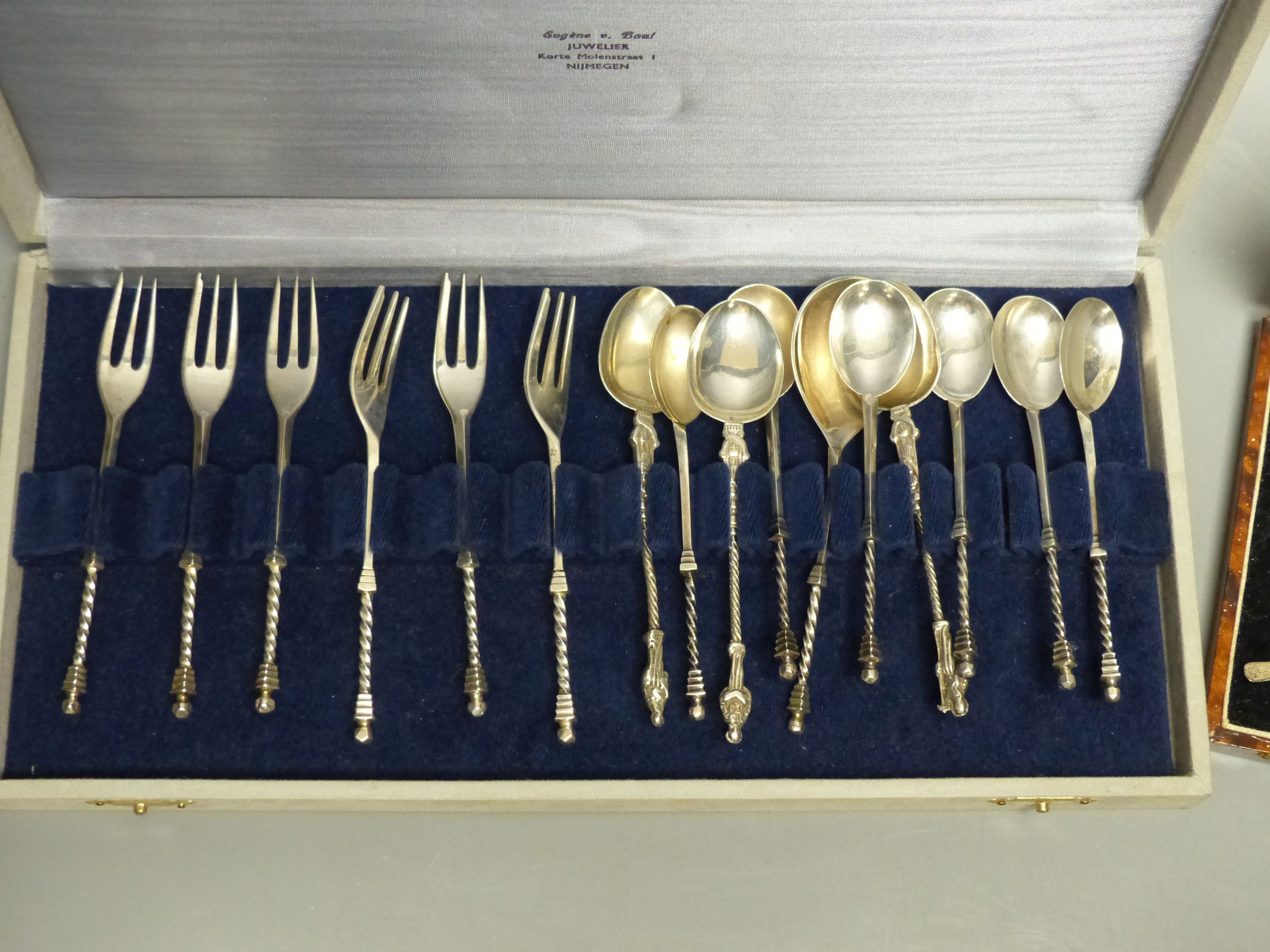 Two cased sets- Dutch white metal spoons & forks and a set of six sterling 'golf club' cocktail sticks? & 4 other spoons.